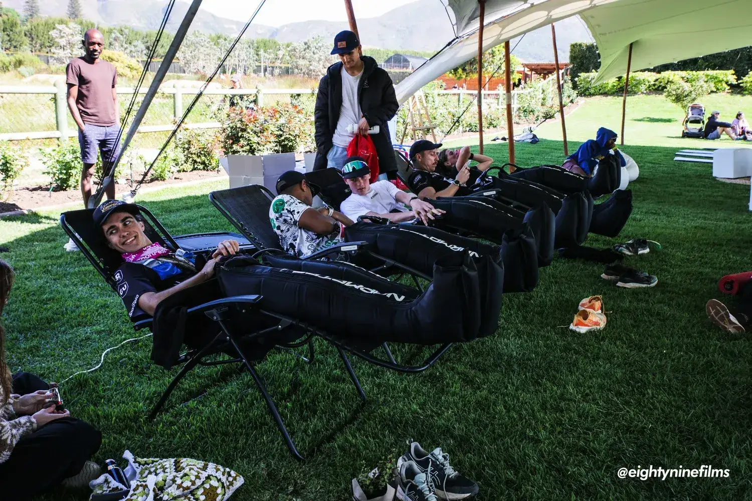 Runners in compression boots in the recovery zone